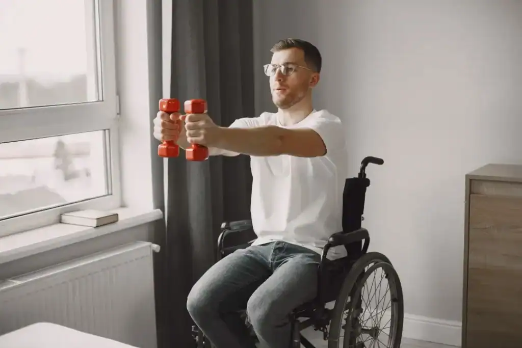 Image of man doing exercise in his wheelchair to aid weight loss Hamilton