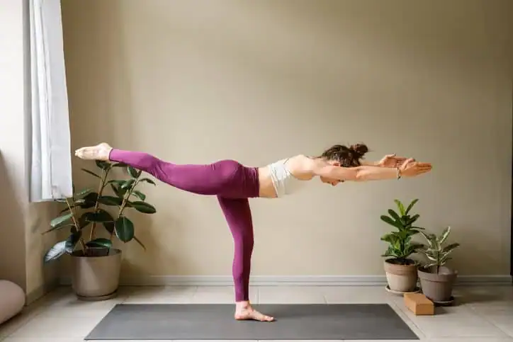 Woman doing Yoga exercise Hamilton to help with toning the body. 