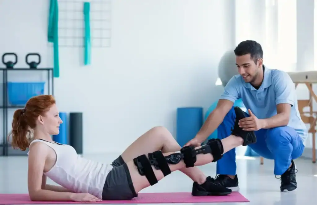 Woman having treatment to help muscle recovery Hamilton after an injury