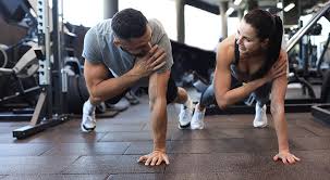 Sculpting Sleek Arms: The Essential Role of Cardio in Toning Without Bulking Up 1 Image of man and woman doing Cardio Hamilton to tone their arms.
